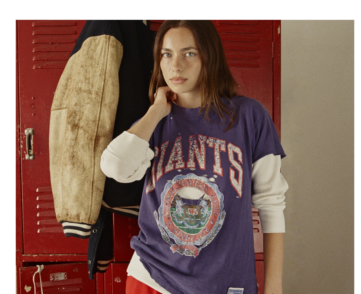 A vintage Giants tee in front of red lockers